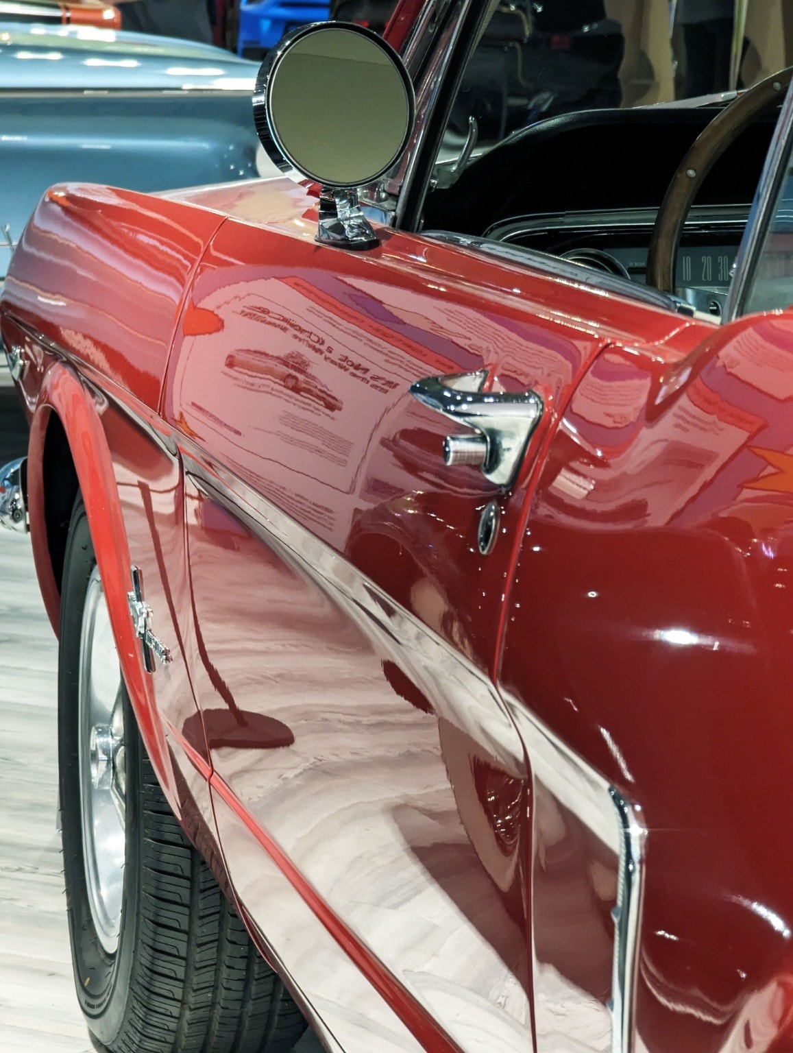1966 Ford Mustang front-quarter detail in Kandy Apple Red — historic automotive colour reference for Eclipse designation KK11